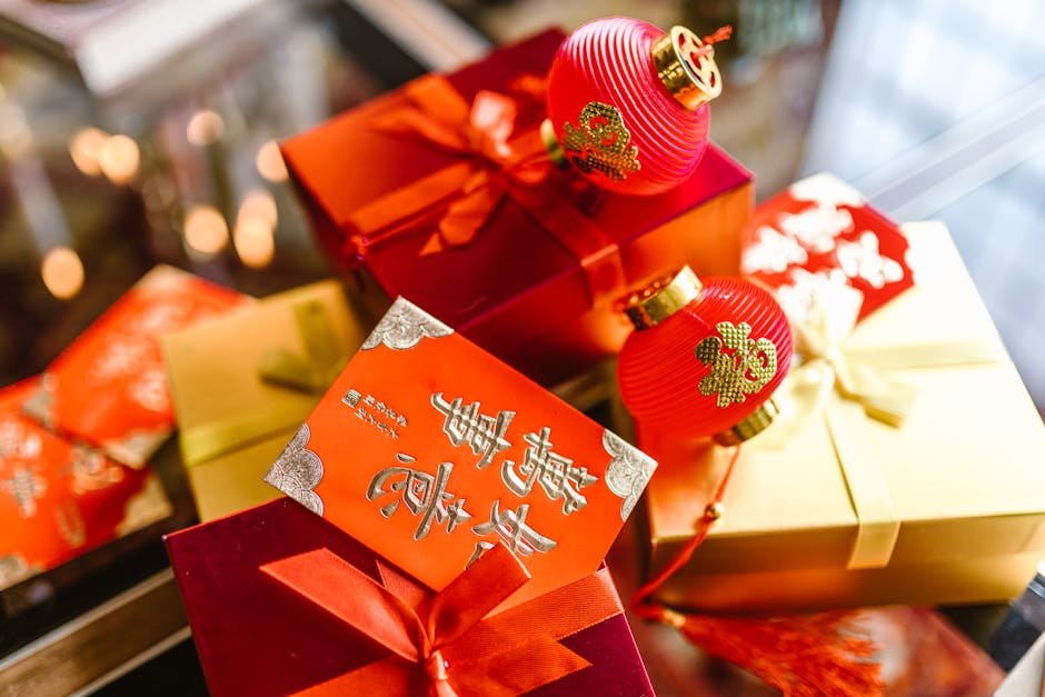 pexels-photo-6692117-6692117 Colorful gift boxes with red packets and lanterns for Chinese New Year celebration.